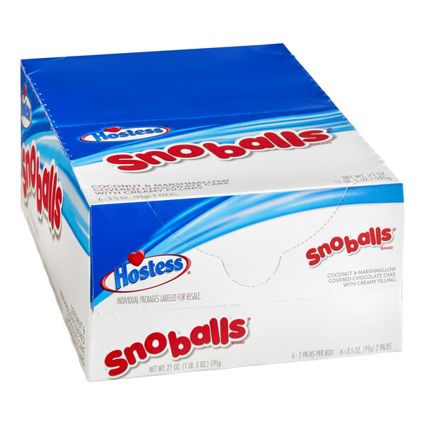 A blue and white box of Hostess Snoball cakes with red text.