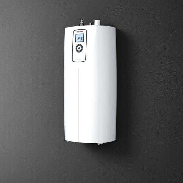 An instant hot water dispenser with a digital display, mounted on a wall.