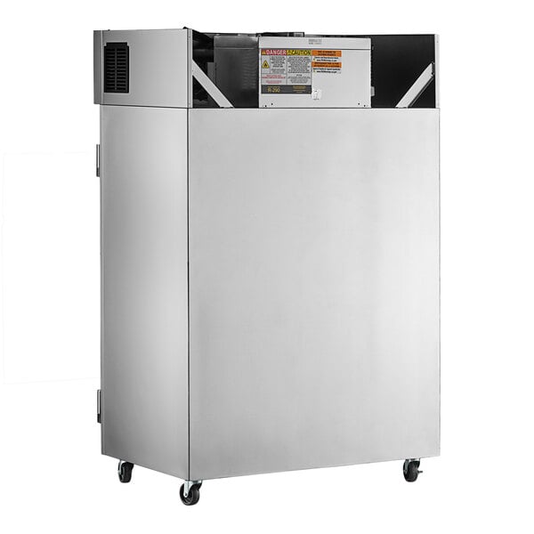 A large stainless steel Delfield refrigerator with wheels.