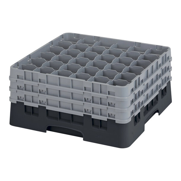 A stack of grey and black plastic Cambro glass racks.