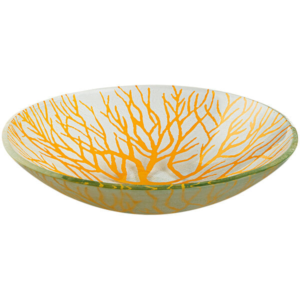 A Rosseto Kalderon round glass bowl with yellow and orange branches on it.
