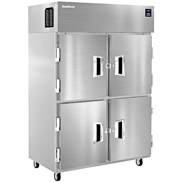 A large silver Delfield reach-in refrigerator with two half doors.