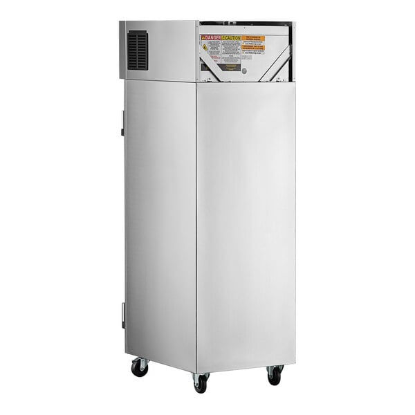 A white rectangular Delfield reach-in refrigerator with a black handle on wheels.