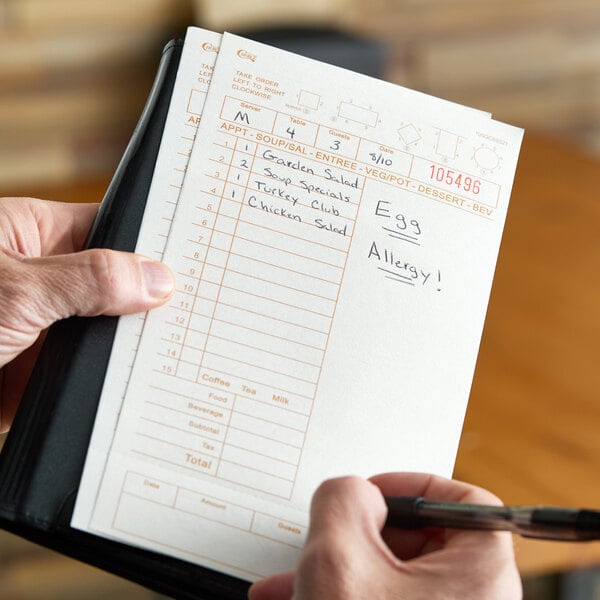 A tan and white restaurant guest check with note space, beverage lines, and a bottom guest receipt section.