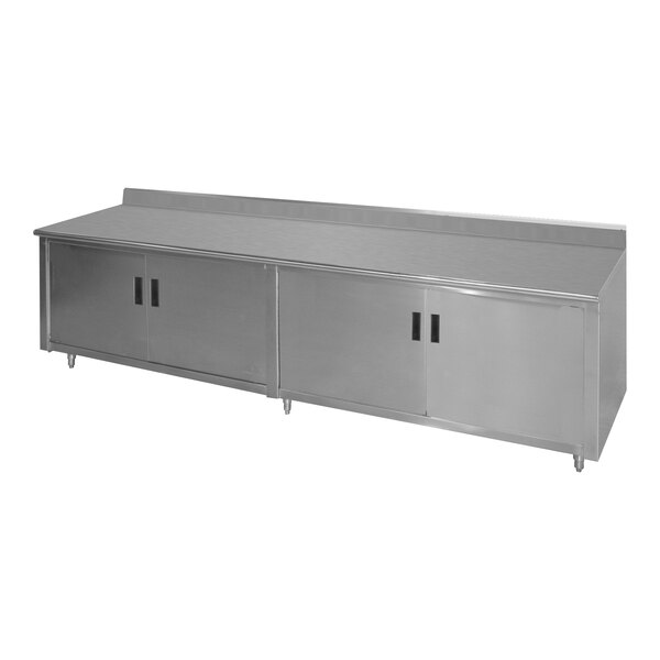 A stainless steel enclosed base work table with a fixed midshelf.