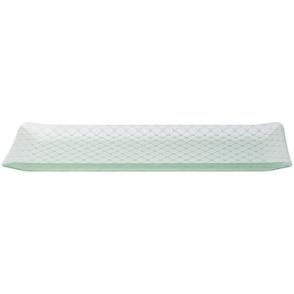 A rectangular white glass tray with a pattern.