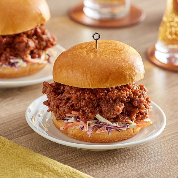 A burger made with Impossible Foods plant-based ground beef on a plate.
