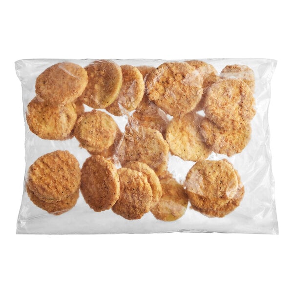 A bag of Harvest Creations Dipt'n Dusted Fried Green Tomatoes on a white background.
