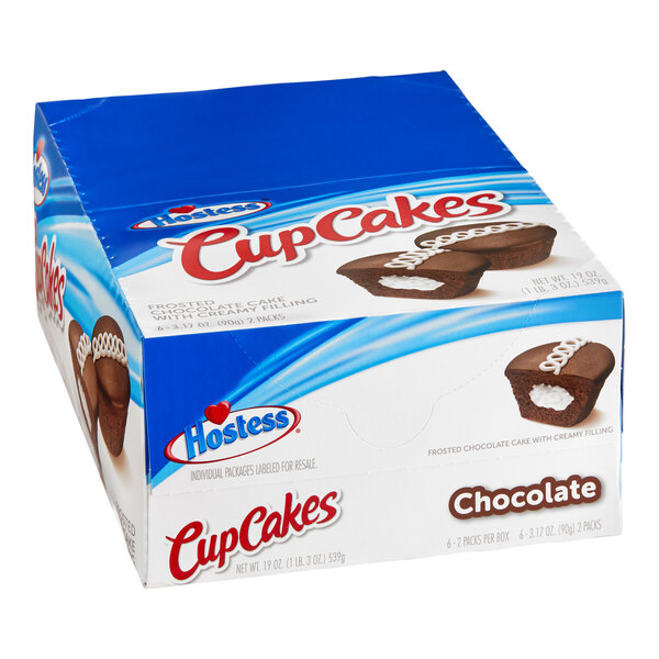 A box of Hostess chocolate cupcakes with white frosting.