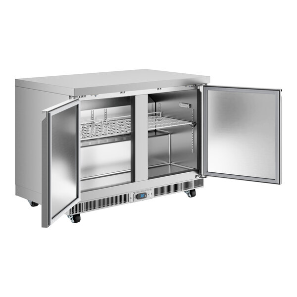 An Avantco stainless steel undercounter refrigerator with two doors open.