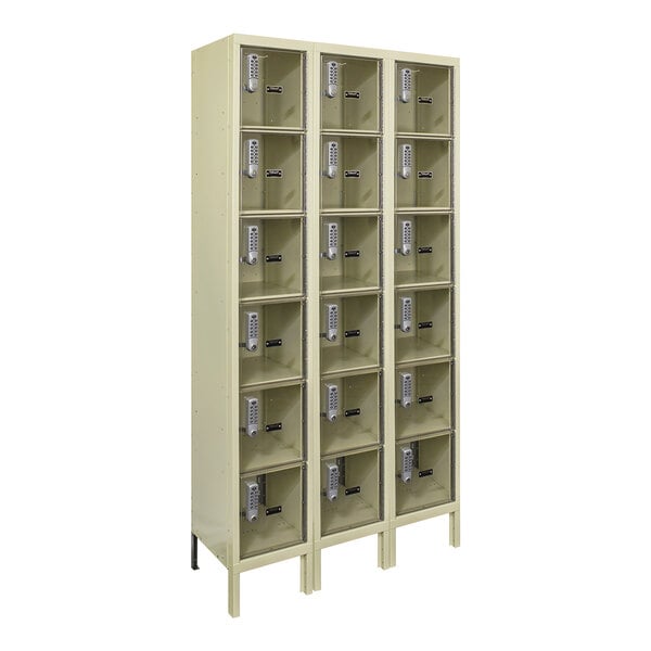 A tan Hallowell metal box locker with six compartments.