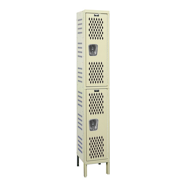 A tan metal locker with two doors and ventilation holes.