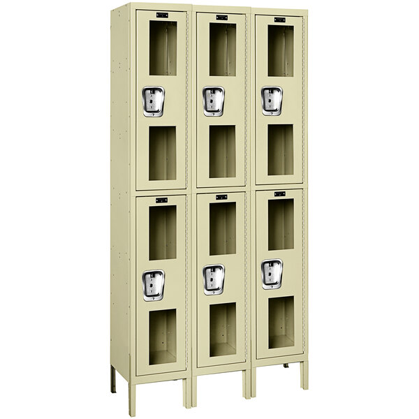 Three Hallowell tan triple 2-tier lockers with glass doors.