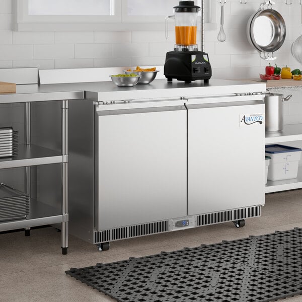 An Avantco stainless steel worktop freezer on a counter.