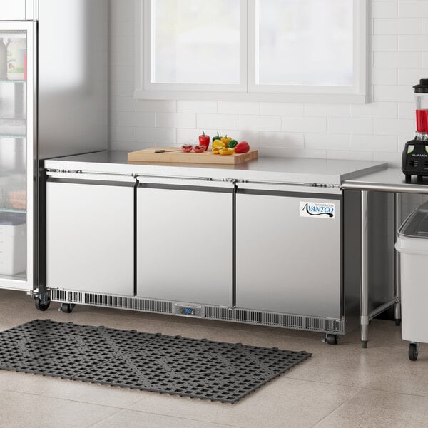 An Avantco stainless steel undercounter refrigerator with a glass door.