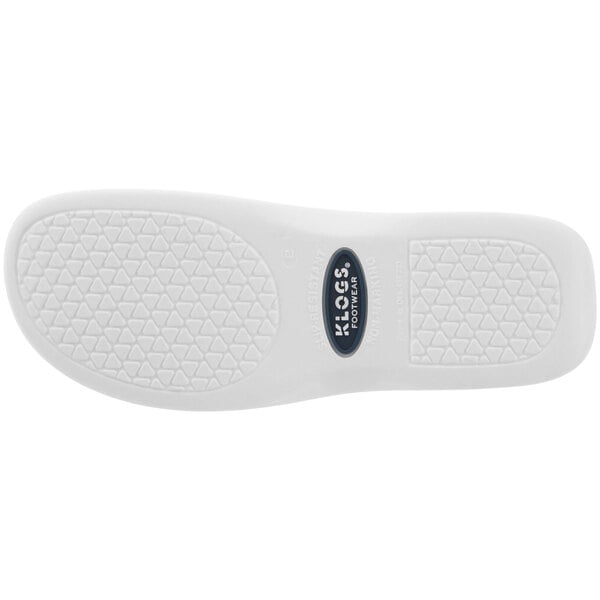 The white rubber sole of a Klogs Boca women's clog with a logo.