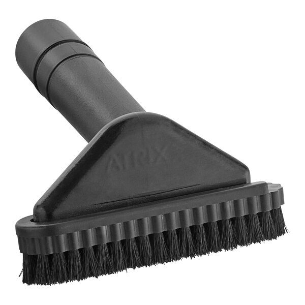 A black Lavex upholstery brush with a handle.