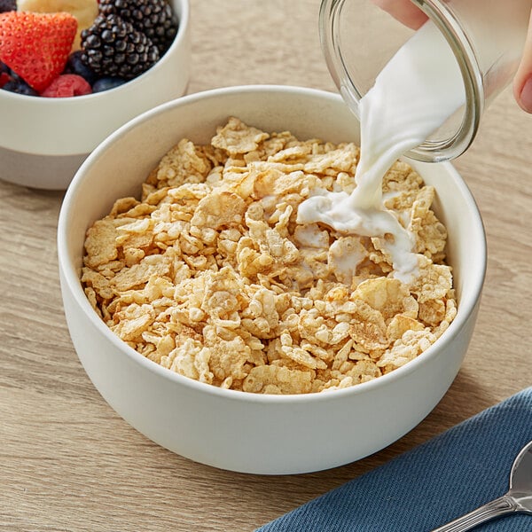 A bowl of Kellogg's Special K cereal with milk being poured into it.