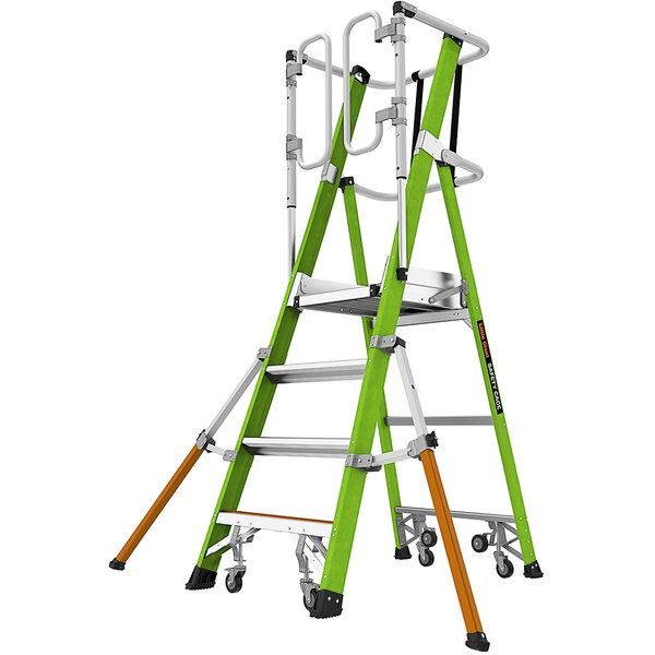 A green Little Giant fiberglass ladder with wheels and orange handles.