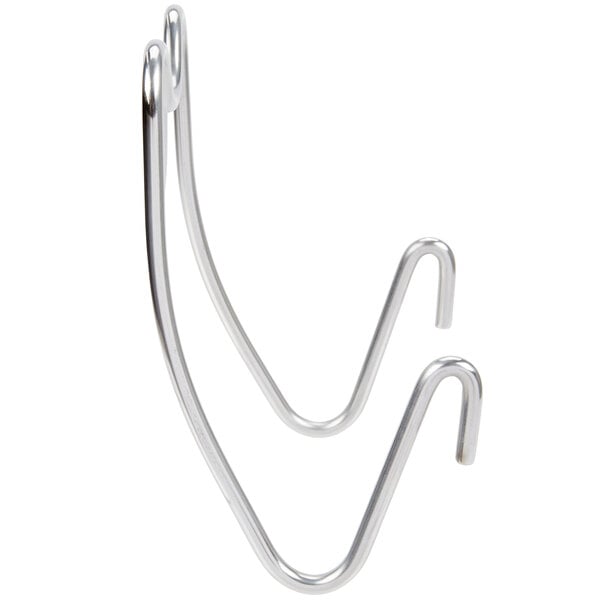 A close-up of a pair of metal hooks.