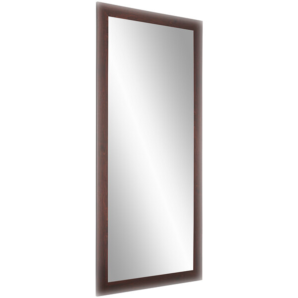 A rectangular BrandtWorks mirror with a dark walnut frame.