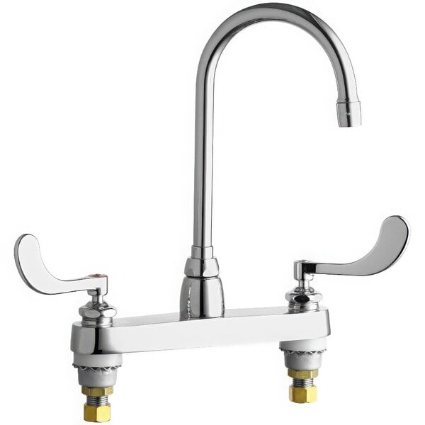 A chrome Chicago Faucets deck-mounted faucet with gooseneck spout and wristblade handles.