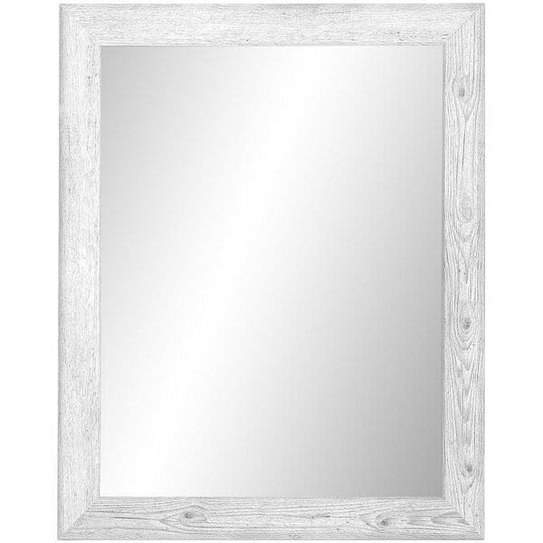 A BrandtWorks white rectangular mirror with a wooden frame.