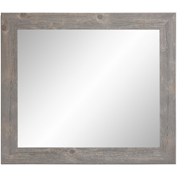 A BrandtWorks mirror with a barnwood gray finish wooden frame.