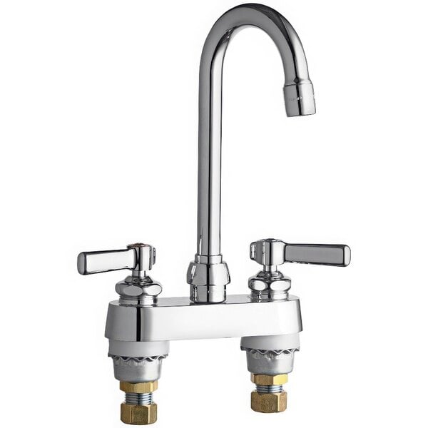 A chrome Chicago Faucets deck-mounted faucet with two lever handles.