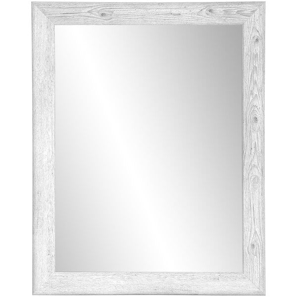 A white rectangular BrandtWorks mirror with a wooden frame.