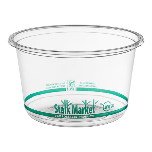 A clear Stalk Market PLA deli container with a green label.
