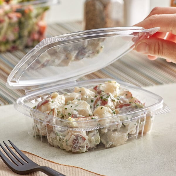 A rectangular clear plastic Stalk Market deli container with potato salad inside.