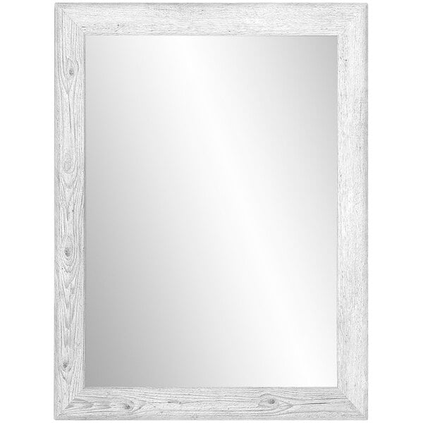 A white rectangular mirror with a wooden frame on a white wall.