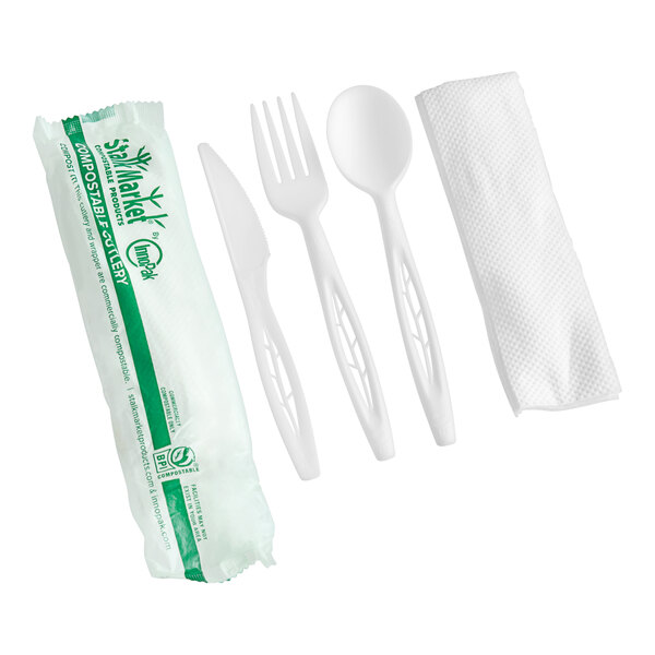 A close-up of a white Stalk Market heavy weight plastic fork and spoon.