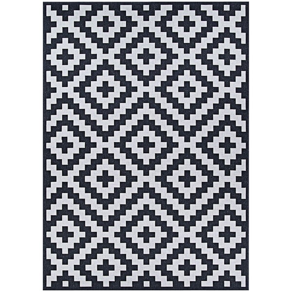 A black and white Couristan Afuera Diatomic area rug with a geometric pattern.