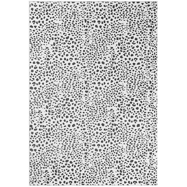 A close-up of a white rectangular rug with black and gray cheetah print.