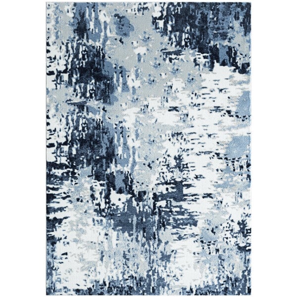 A white area rug with a large blue abstract pattern.