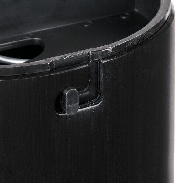 A black San Jamar in-counter cup dispenser with a black gasket and a hole for cups.