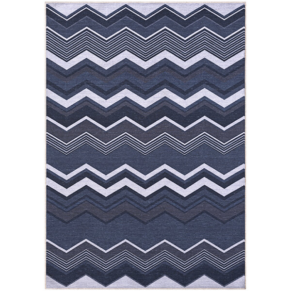 An Abani Parker Collection area rug with a blue zigzag pattern.