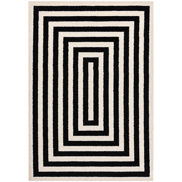 A black and white rectangular rug with square and line designs.