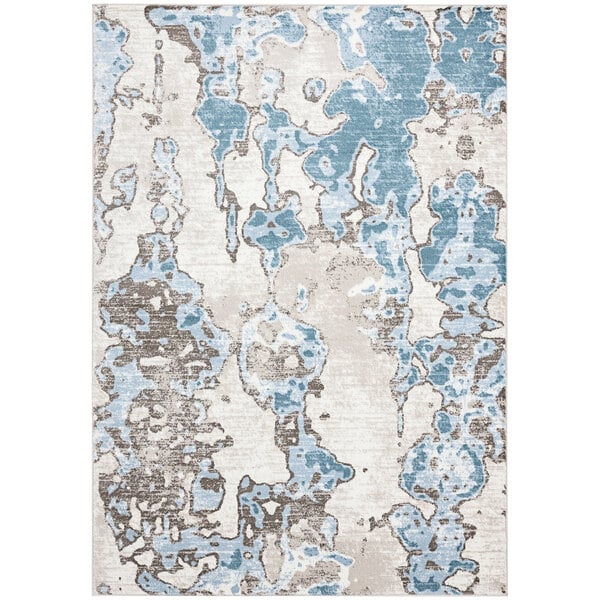 An Abani Arto teal and beige area rug with abstract blue and white designs.