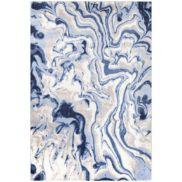 An Abani Arto teal rug with a white swirl pattern.
