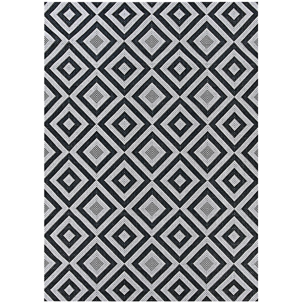 A black and white Couristan Afuera area rug with a diamond pattern.