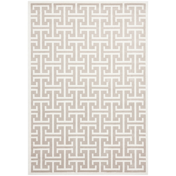 An Abani Arto cream and beige area rug with a geometric pattern.
