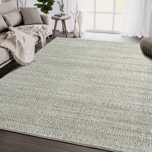 An Abani Cabo Collection area rug with a cream and gray striped pattern.