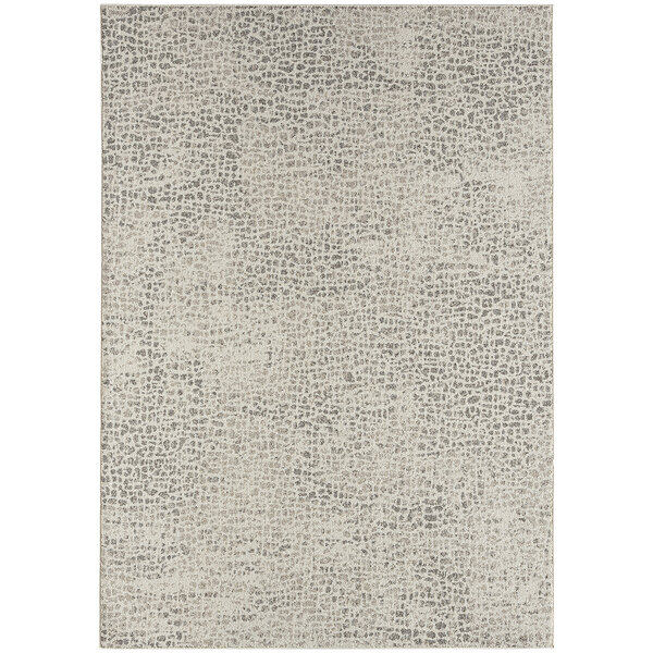 An Abani Layla Collection beige and brown area rug with a distressed animal print pattern.