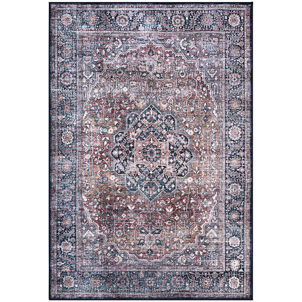 An Abani Lola vintage medallion area rug with blue, brown, and beige colors and an ornate pattern.