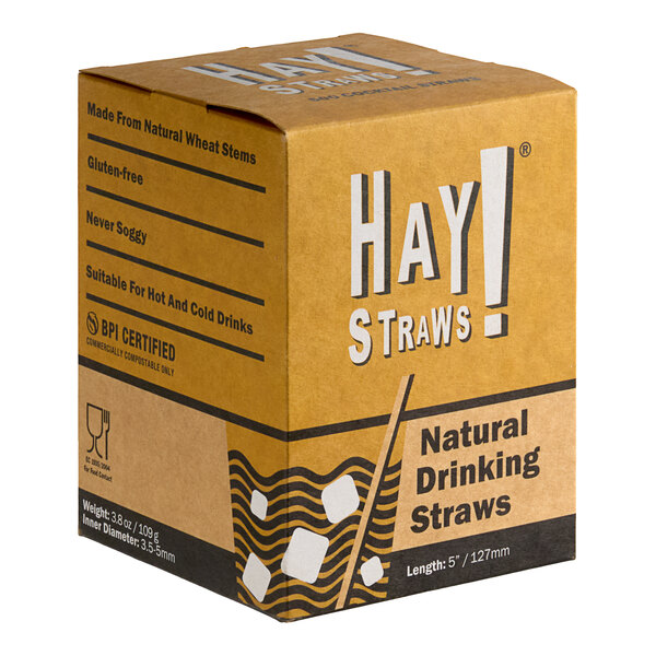 A brown box with black and white text containing HAY! Natural Wheat Compostable Cocktail Straws.