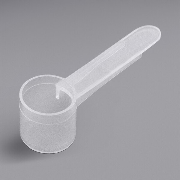 A white plastic measuring scoop with a medium handle.