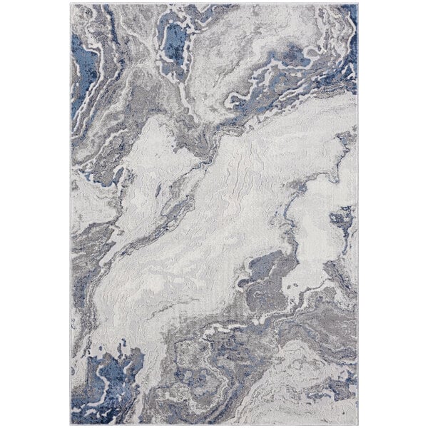 An Abani Atlas Collection area rug with a white background and blue and grey abstract marble pattern.